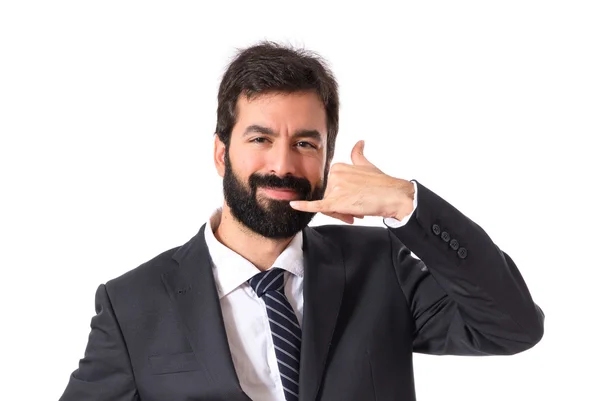 Uomo d'affari che fa gesti telefonici su sfondo bianco — Foto Stock