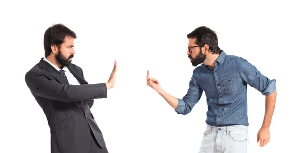 Hipster man making horn gesture at his brother — Stock Photo, Image
