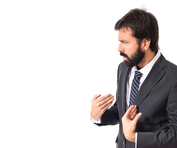 Businessman doing surprise gesture over white background — Stock Photo, Image