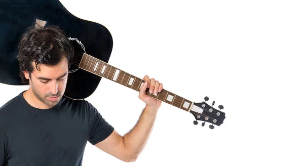 Schöner Mann mit Gitarre vor weißem Hintergrund — Stockfoto