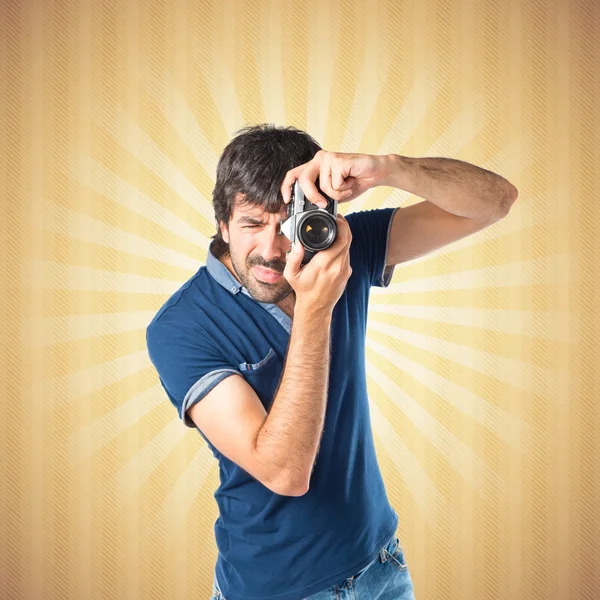 Man photographing over pop background — Stock Photo, Image