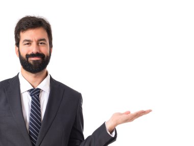 Bir şey izole beyaz arka plan üzerinde sunulması iş adamı