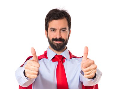 Başparmak ile süper kahraman gibi giyinmiş işadamı 