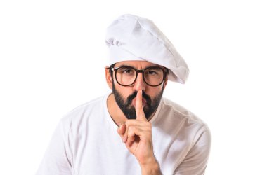 Şef yapım sessizlik jest beyaz arka plan üzerinde