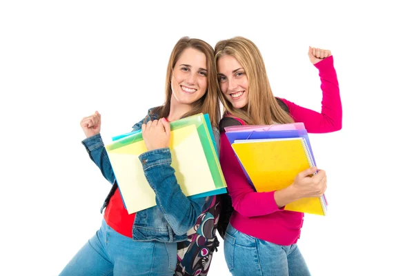 Lucky students over isolated white background — Stock Photo, Image