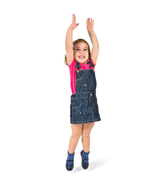 Kid jumping over isolated white background — Stock Photo, Image