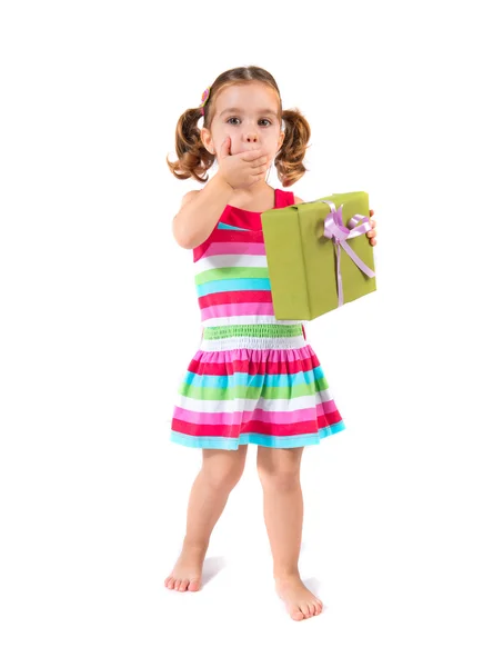 Kid holding a present over white background — Stock Photo, Image