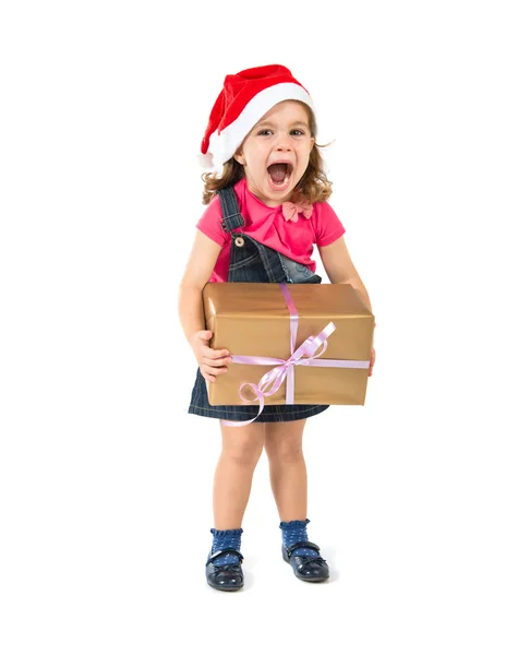 Blonda jul unge med en gåva gör överraskning gest — Stockfoto