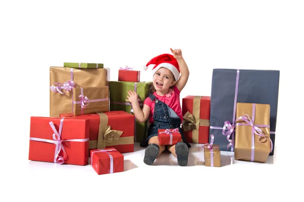 Blonde christmas kid around presents — Stock Photo, Image