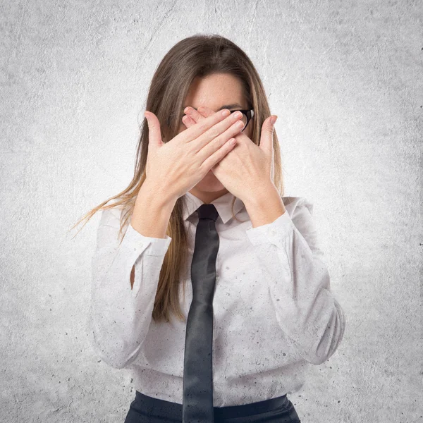 Young businesswoman covering her eyes over isolated white backgr — Stock Photo, Image