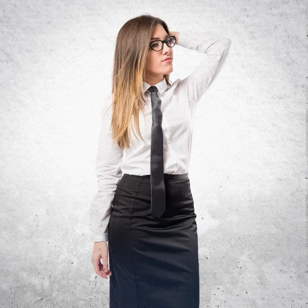 Cute businesswoman thinking an idea over isolated white backgrou — Stock Photo, Image