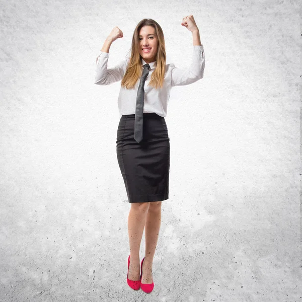 Young businesswoman winning on white background — Stock Photo, Image