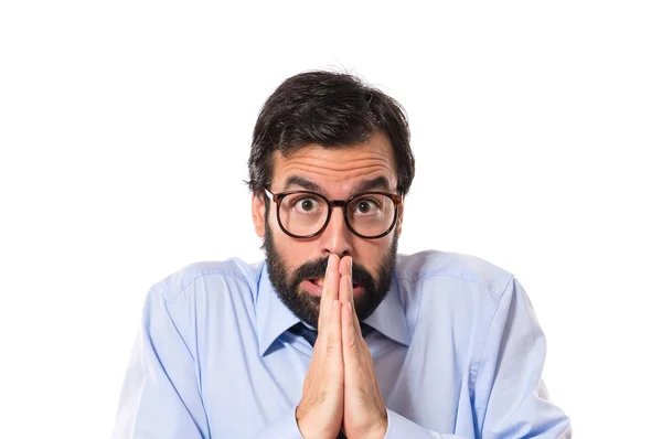 Empresario suplicando sobre fondo blanco — Foto de Stock