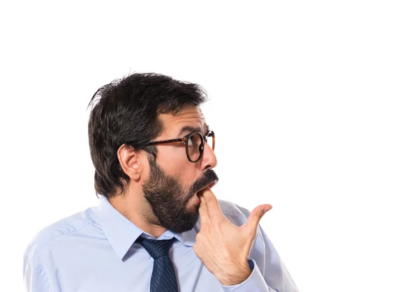 Businessman making suicide gesture over white background — Stock Photo, Image