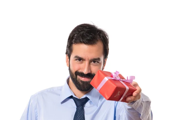 Businessman giving a gift — Stock Photo, Image