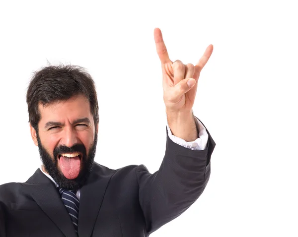 Hombre de negocios haciendo gesto cuerno sobre fondo blanco —  Fotos de Stock