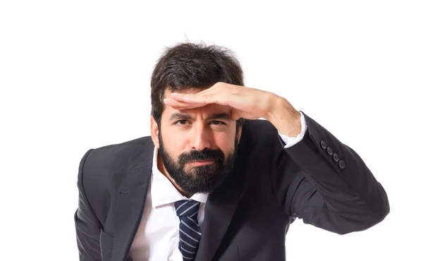 Businessman showing something over white background — Stock Photo, Image