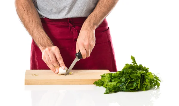 Chef cutting a garlic — Stock Photo, Image