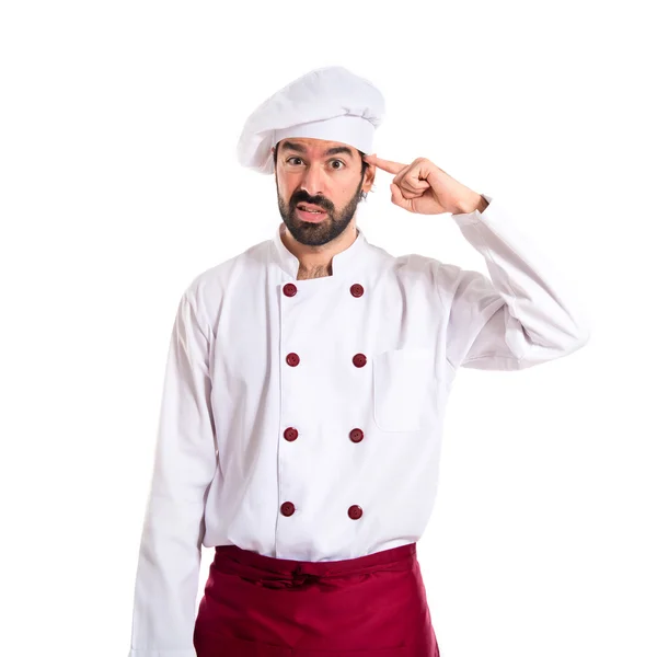 Koch macht verrückte Geste vor weißem Hintergrund — Stockfoto