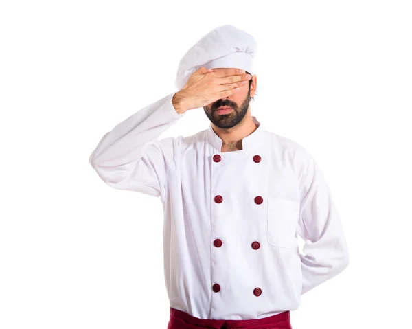 Chef covering his eyes over white background — Stock Photo, Image