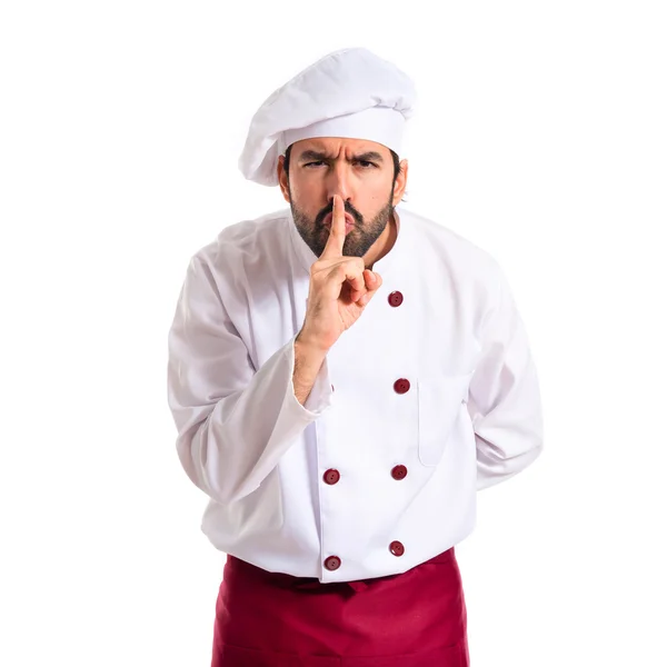 Chef faisant un geste de silence sur fond blanc — Photo