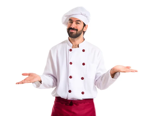 Šéfkuchař s pochybnosti nad bílým pozadím — Stock fotografie