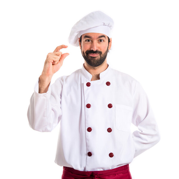 Chef doing tiny sign over white background