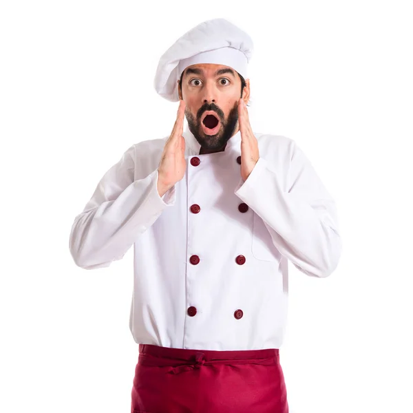 Szef kuchni robi na białym tle niespodzianka gest — Zdjęcie stockowe