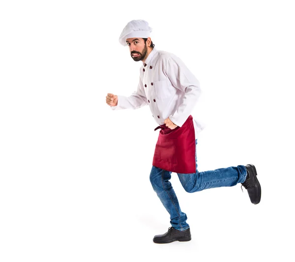 Шеф-повар быстро бегает на белом фоне — стоковое фото