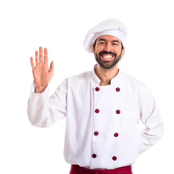 Chef saluant sur fond blanc — Photo