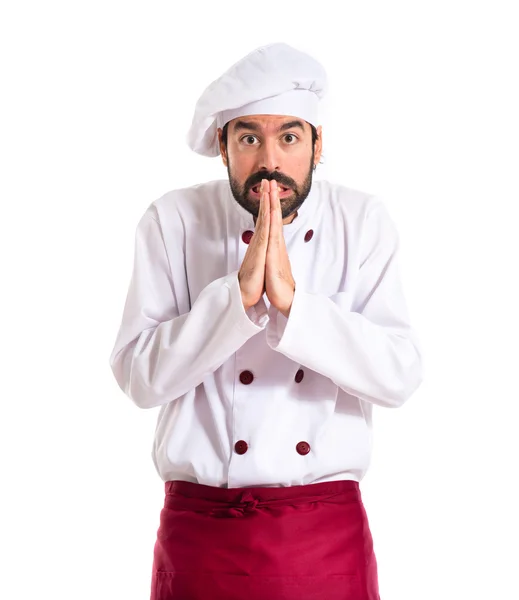 Koch fleht vor weißem Hintergrund — Stockfoto