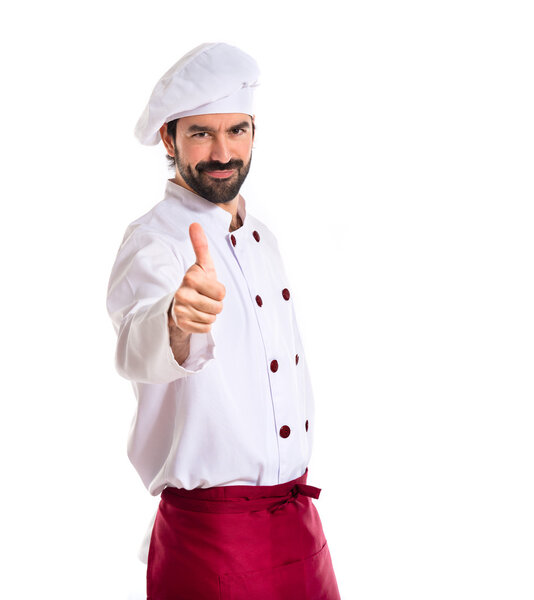 Chef with thumb up over white background