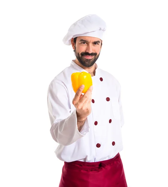 Chef holding yellow pepper — Stock Photo, Image