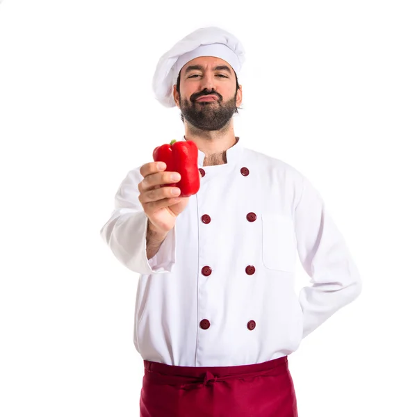 Chef holding red pepper — Stock Photo, Image