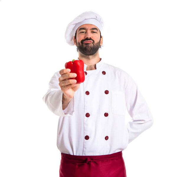 Chef holding red pepper