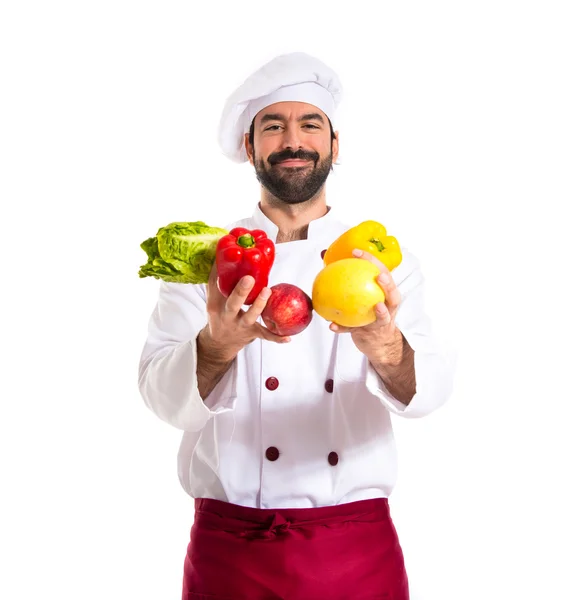 Chef holding vegetables — Stock Photo, Image
