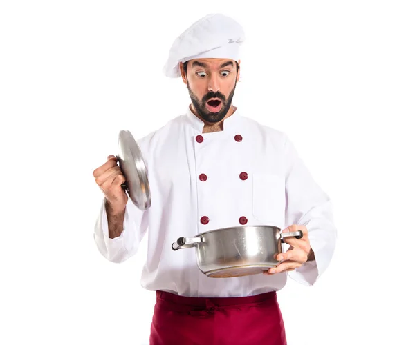 Surprised chef holding a pot — Stock Photo, Image