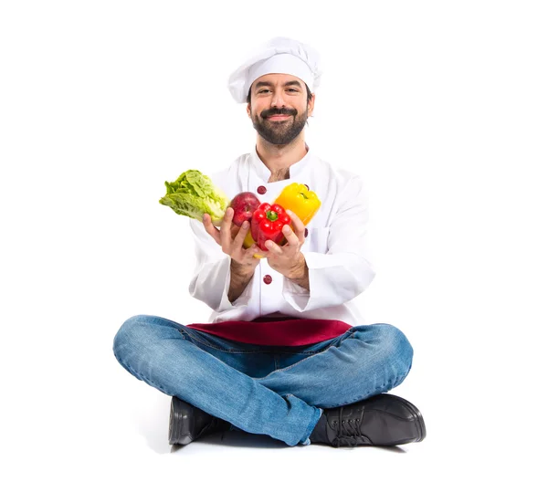 Chef holding vegetables — Stock Photo, Image