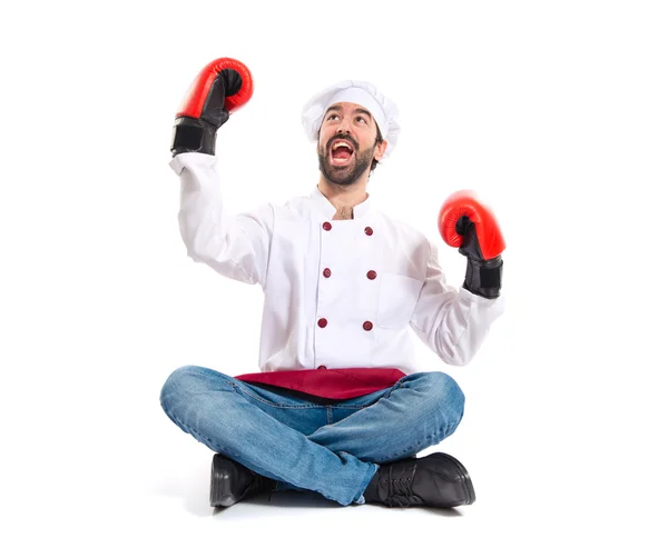 Chef con guantes de boxeo sentado en el suelo —  Fotos de Stock