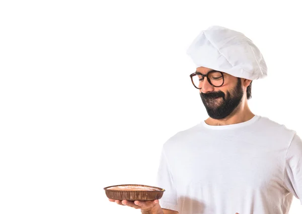 Koch isst einen Kuchen — Stockfoto
