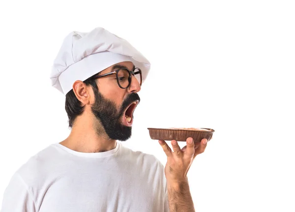 Chef comer um bolo — Fotografia de Stock