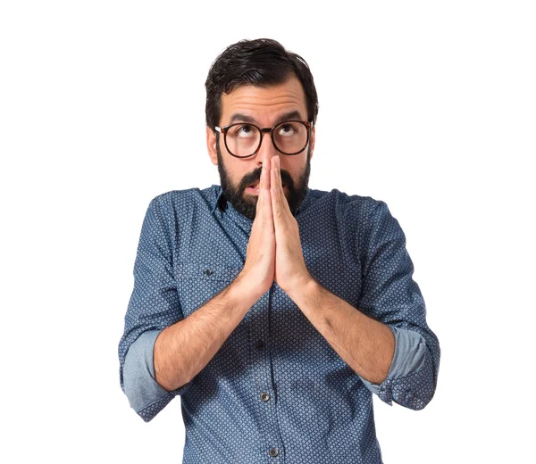 Young hipster man pleading over white background — Stock Photo, Image