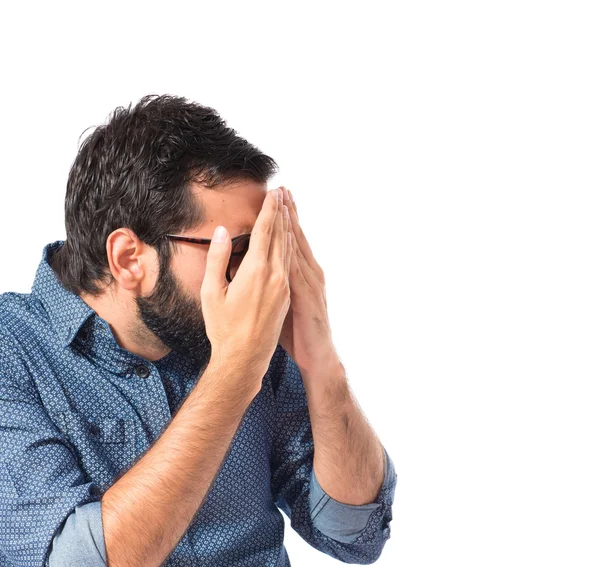 Young hipster man covering his eyes — Stock Photo, Image