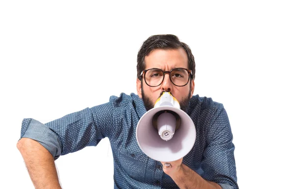 Joven hipster hombre gritando por megáfono —  Fotos de Stock