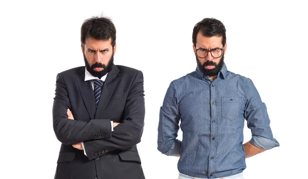 Sad twin brothers over white background — Stock Photo, Image