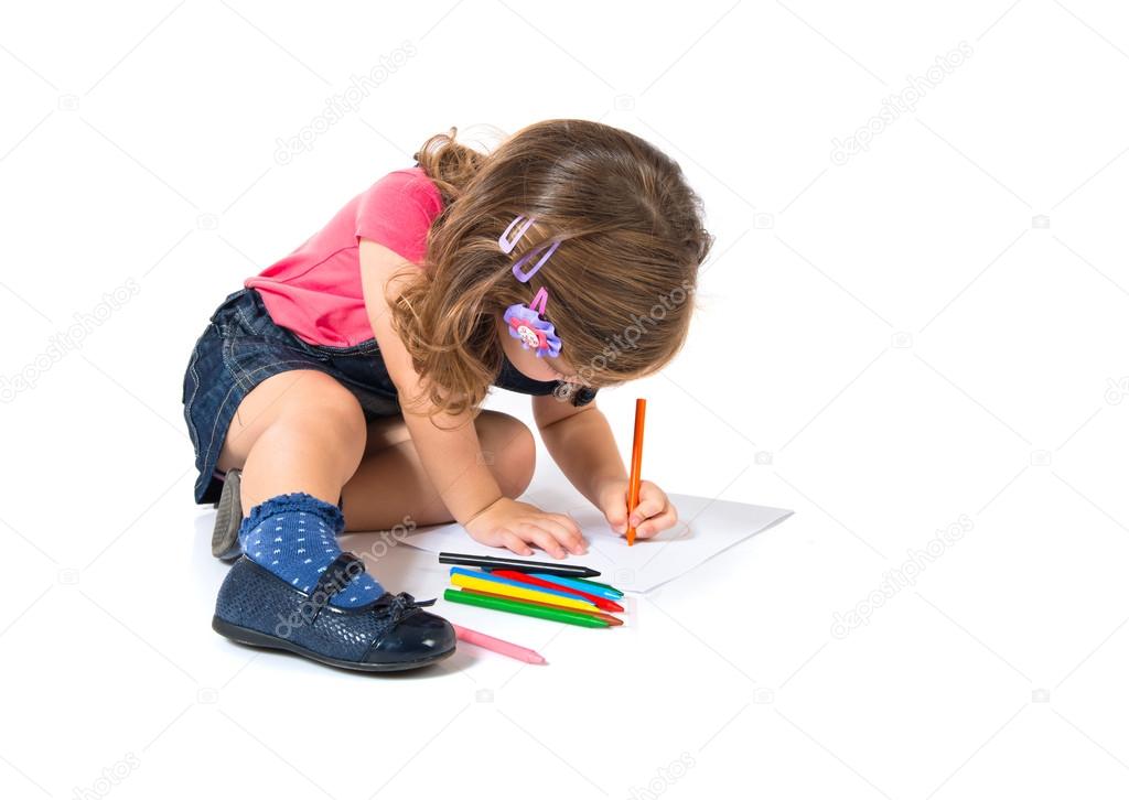 Kid drawing crayons over white background
