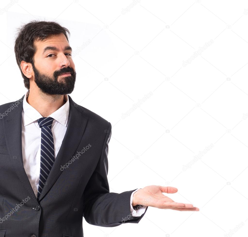 Businessman having doubts over isolated white background
