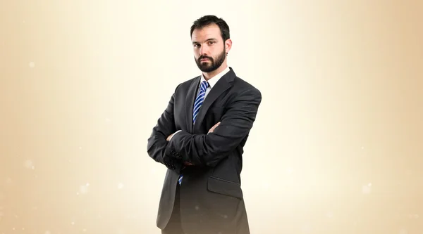 Business man with his arms crossed over isolated background — Stock Photo, Image