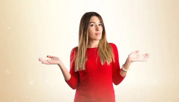 Cute young girl having doubts over isolated white background — Stock Photo, Image