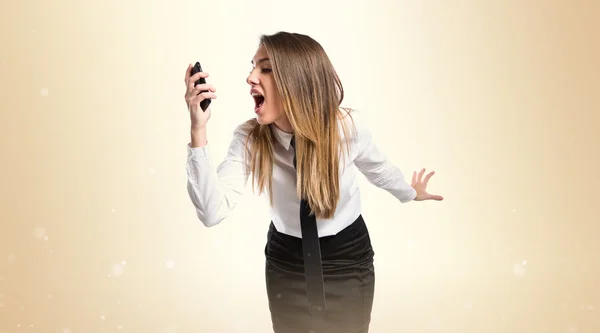 Chica hablando con móvil sobre fondo aislado . — Foto de Stock